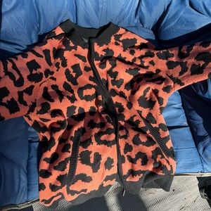 Torrid orange and black leopard print zip up sweater
